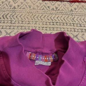 Cute and comfortable urban outfitters top. Cropped with a high neck line.